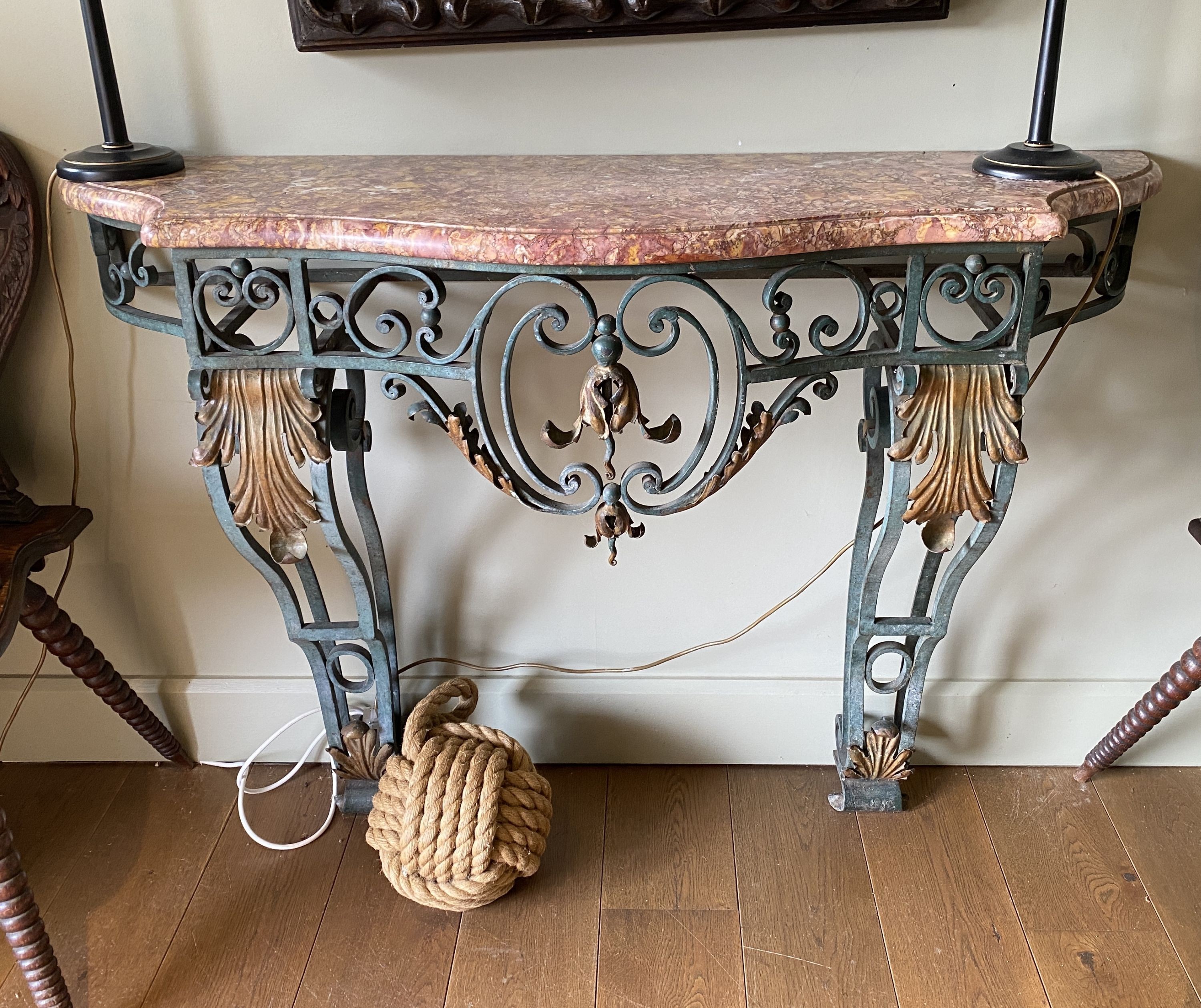 A French painted and gilt wrought iron console table, with serpentine marble top, width 132cm depth 40cm height 94cm